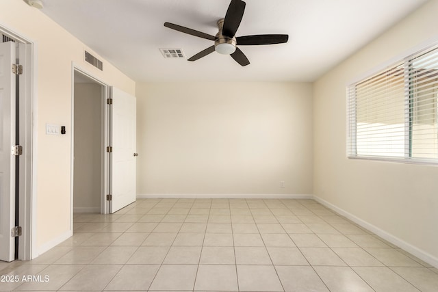 2130 W Colter St, Phoenix, AZ 85015 - empty room with a ceiling fan, baseboards, and light tile patterned floors