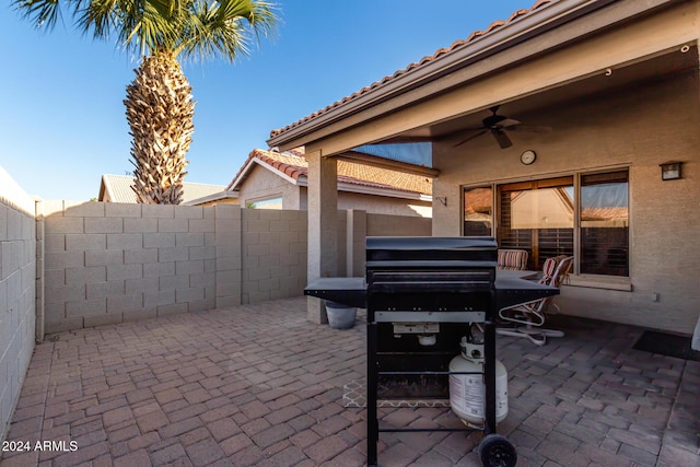 view of patio featuring ceiling fan