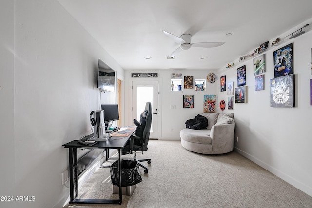 carpeted office with ceiling fan