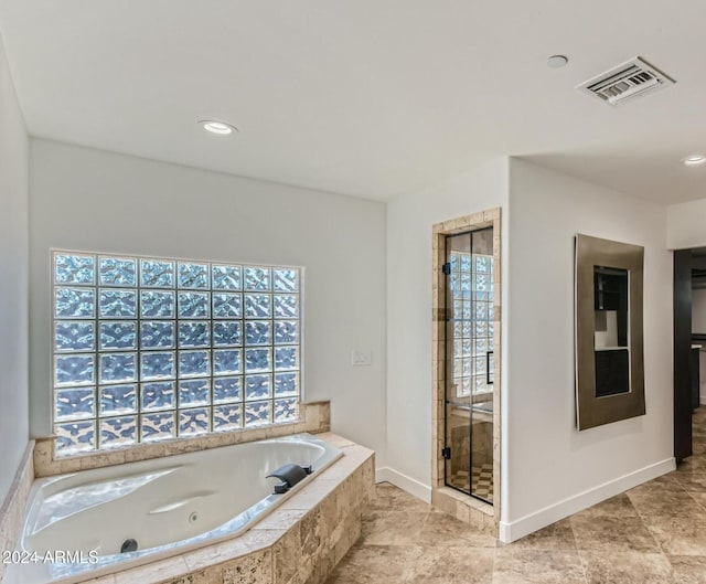 bathroom with tiled bath