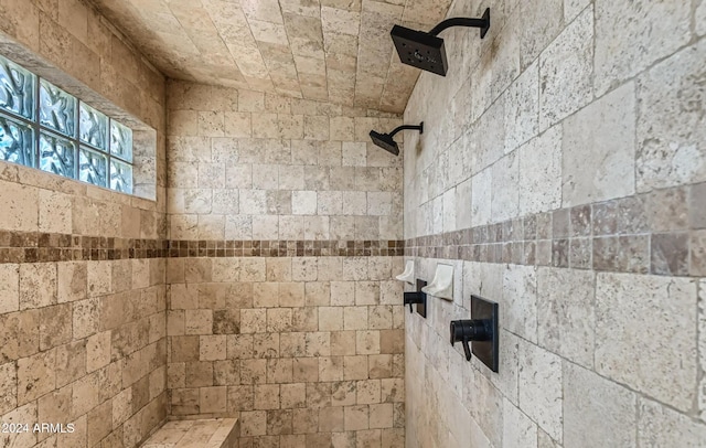 bathroom featuring a tile shower