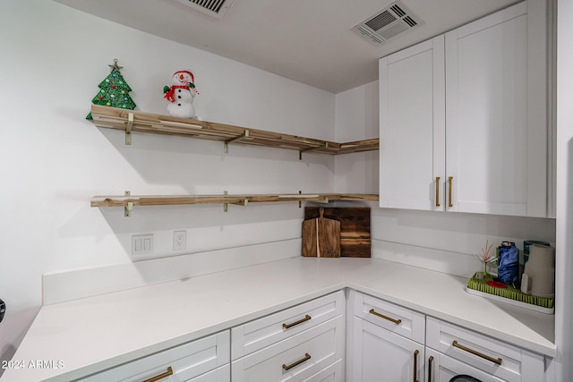 kitchen featuring white cabinets