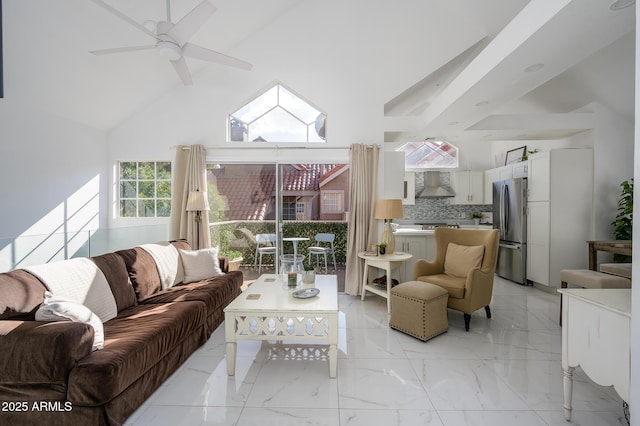 living room with high vaulted ceiling and ceiling fan