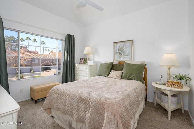 bedroom with ceiling fan, lofted ceiling, and light carpet