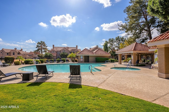 view of swimming pool featuring a gazebo, a lawn, a hot tub, and a patio area