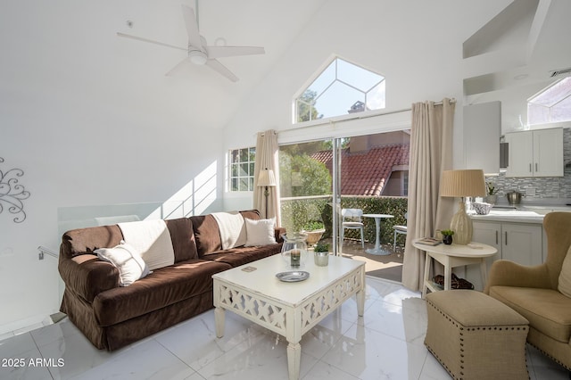 living room featuring high vaulted ceiling and ceiling fan