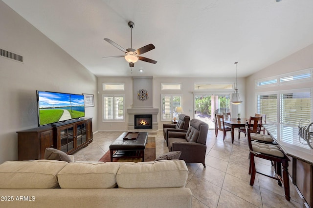 living room featuring light tile patterned flooring, ceiling fan, and high vaulted ceiling