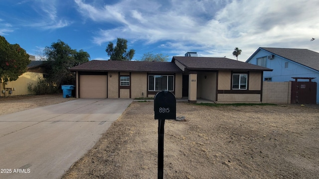 single story home featuring a garage