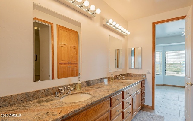 26215 N 115th Ave, Peoria, AZ 85383 - full bath featuring tile patterned floors, double vanity, and baseboards