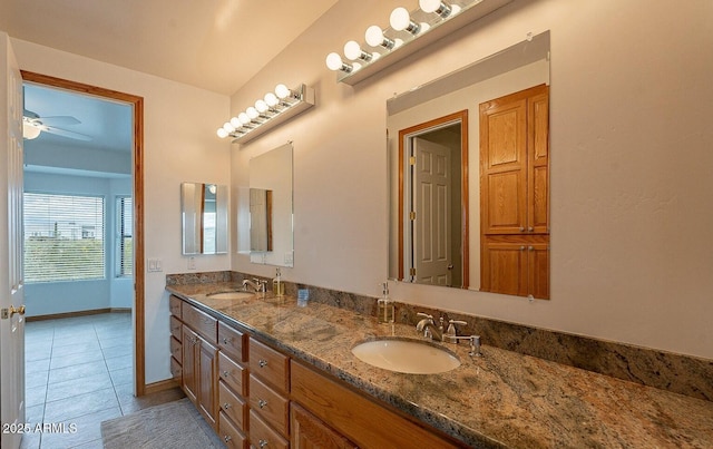 26215 N 115th Ave, Peoria, AZ 85383 - bathroom with tile patterned floors, a ceiling fan, double vanity, and baseboards