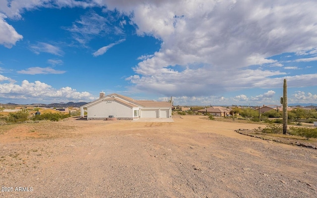 26215 N 115th Ave, Peoria, AZ 85383 - view of yard with a garage and driveway