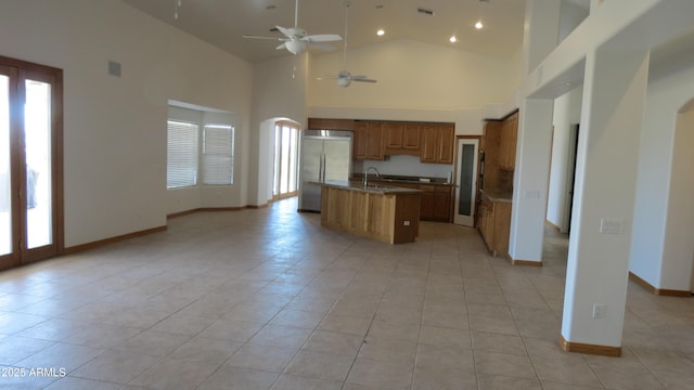 26215 N 115th Ave, Peoria, AZ 85383 - kitchen featuring stainless steel built in refrigerator, plenty of natural light, open floor plan, high vaulted ceiling, and recessed lighting