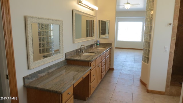 26215 N 115th Ave, Peoria, AZ 85383 - full bath with tile patterned flooring, ceiling fan, baseboards, and double vanity