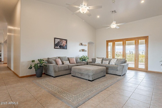 26215 N 115th Ave, Peoria, AZ 85383 - living room featuring high vaulted ceiling, light tile patterned flooring, a ceiling fan, arched walkways, and baseboards