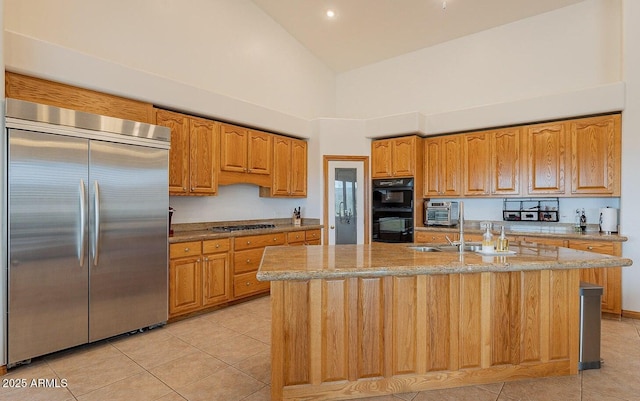 26215 N 115th Ave, Peoria, AZ 85383 - kitchen with built in fridge, high vaulted ceiling, cooktop, light tile patterned flooring, and light stone countertops