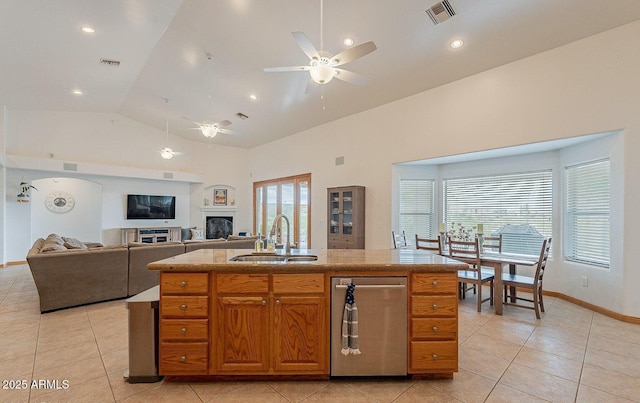 26215 N 115th Ave, Peoria, AZ 85383 - kitchen featuring a sink, a ceiling fan, light tile patterned flooring, a fireplace, and stainless steel dishwasher