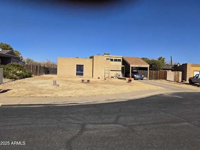 view of front of property featuring a carport