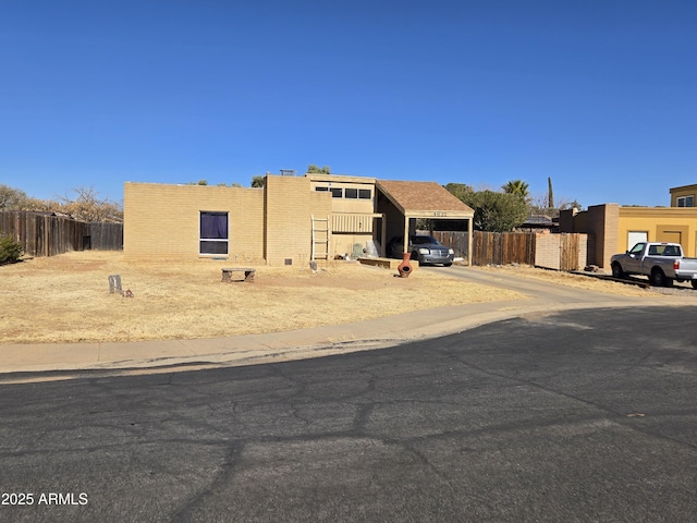 view of front of home with a carport