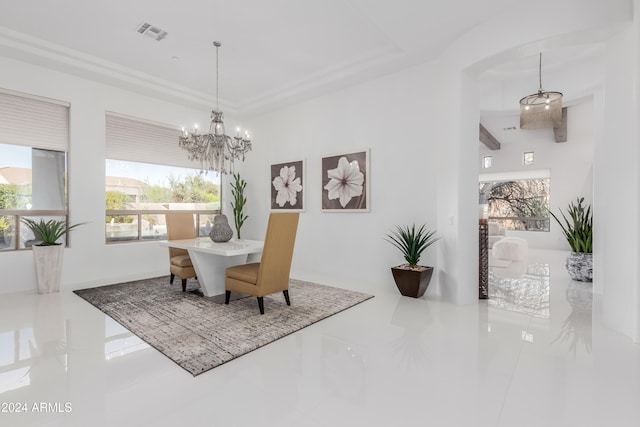 tiled dining space featuring a wealth of natural light and an inviting chandelier