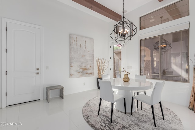 dining room with beam ceiling, an inviting chandelier, and tile patterned floors