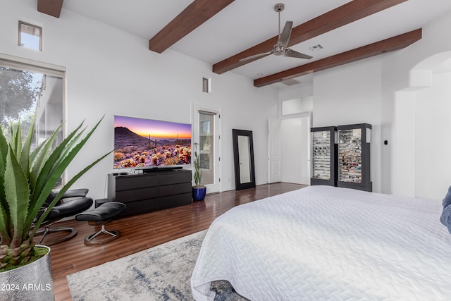 bedroom with dark wood-type flooring, a high ceiling, french doors, ceiling fan, and beamed ceiling