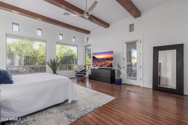 bedroom with a towering ceiling, access to outside, ceiling fan, dark wood-type flooring, and beam ceiling