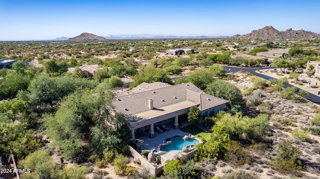 birds eye view of property with a mountain view