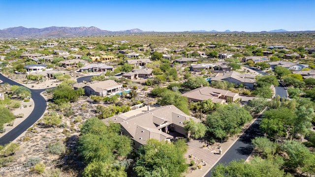 birds eye view of property with a mountain view