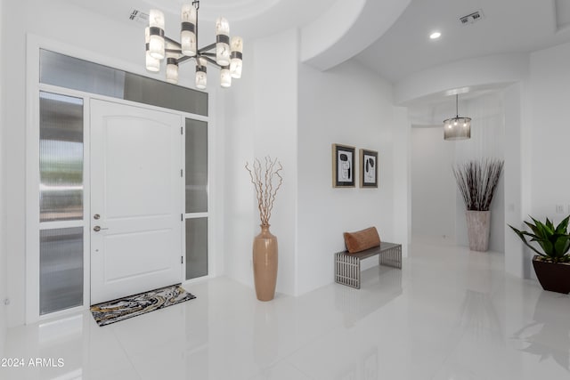 entrance foyer featuring a notable chandelier