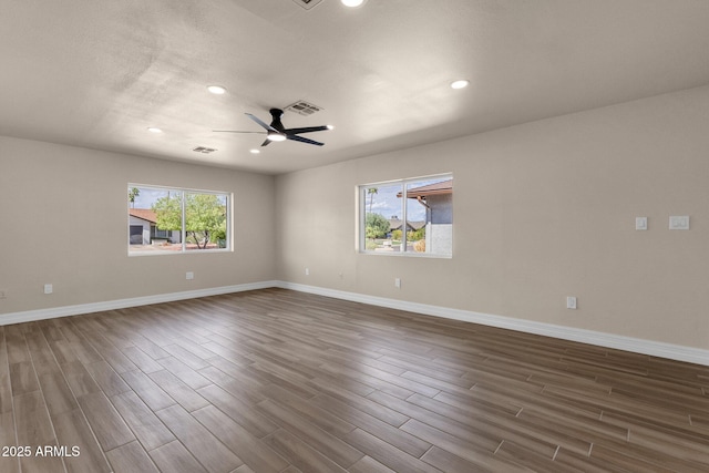4913 E Acoma Dr, Scottsdale, AZ 85254 - unfurnished room with healthy amount of natural light, dark wood-style floors, recessed lighting, and baseboards