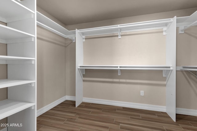 4913 E Acoma Dr, Scottsdale, AZ 85254 - walk in closet with wood finish floors