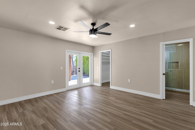 4913 E Acoma Dr, Scottsdale, AZ 85254 - empty room with a ceiling fan, french doors, wood finished floors, baseboards, and recessed lighting