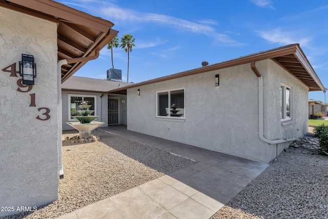 4913 E Acoma Dr, Scottsdale, AZ 85254 - back of house featuring stucco siding and a patio