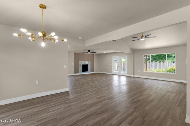 4913 E Acoma Dr, Scottsdale, AZ 85254 - unfurnished living room with dark wood-style flooring, a chandelier, lofted ceiling, baseboards, and a ceiling fan