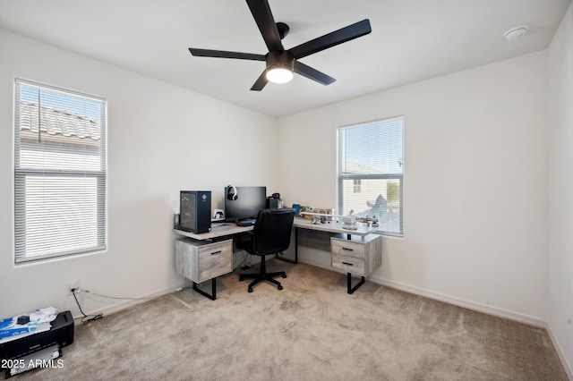 office area with light carpet and ceiling fan