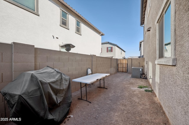 view of patio featuring cooling unit and grilling area