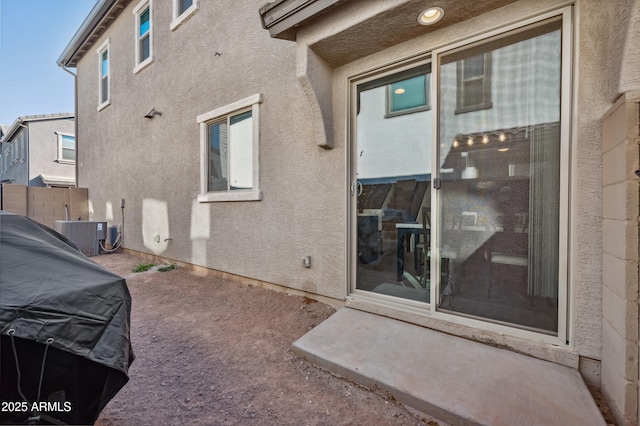 rear view of property featuring central AC unit