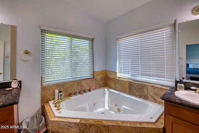 3298 W Monte Vista Trl, Benson, AZ 85602 - full bathroom with vaulted ceiling, vanity, and a whirlpool tub