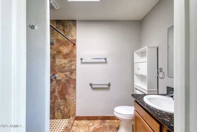 3298 W Monte Vista Trl, Benson, AZ 85602 - full bath featuring toilet, tile patterned floors, vanity, baseboards, and tiled shower