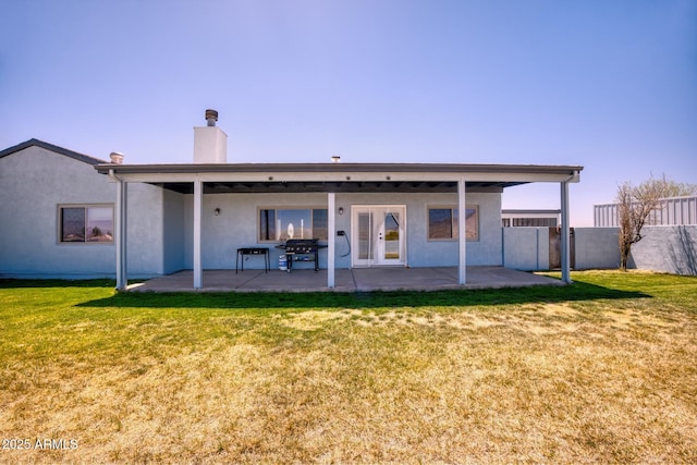 3298 W Monte Vista Trl, Benson, AZ 85602 - rear view of property with stucco siding, fence, a patio area, and a lawn