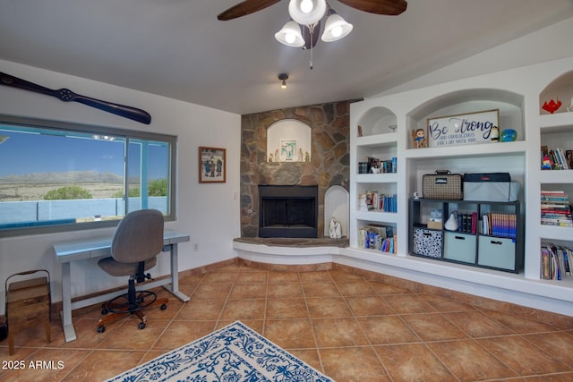 3298 W Monte Vista Trl, Benson, AZ 85602 - tiled home office with a stone fireplace, built in features, baseboards, and ceiling fan
