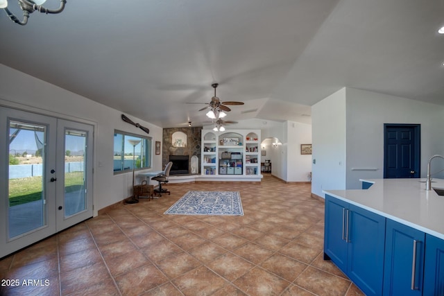 3298 W Monte Vista Trl, Benson, AZ 85602 - living room with lofted ceiling, french doors, baseboards, built in features, and ceiling fan