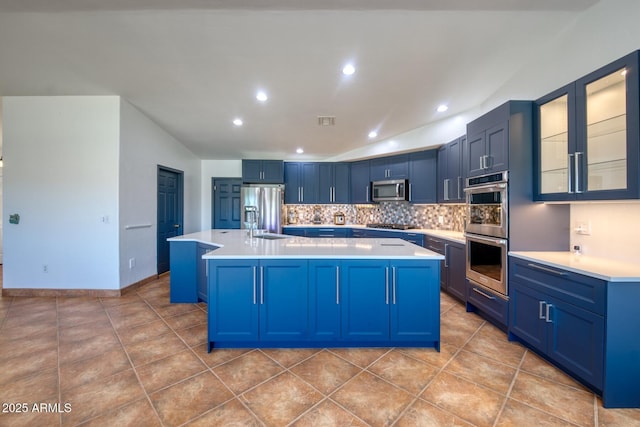 3298 W Monte Vista Trl, Benson, AZ 85602 - kitchen with blue cabinets, light tile patterned floors, appliances with stainless steel finishes, and light countertops