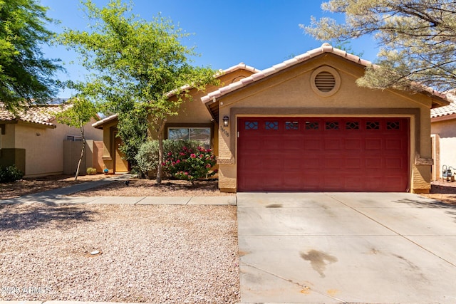 16118 W Morning Glory St, Goodyear, AZ 85338 - view of front of property featuring driveway, an attached garage, stucco siding, and a tile roof
