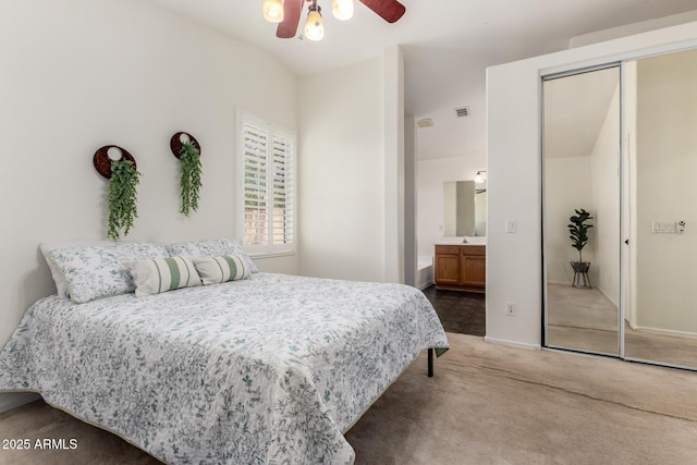 16118 W Morning Glory St, Goodyear, AZ 85338 - bedroom featuring carpet flooring, a closet, lofted ceiling, connected bathroom, and a ceiling fan