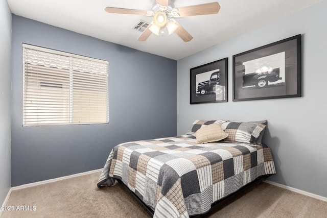 16118 W Morning Glory St, Goodyear, AZ 85338 - carpeted bedroom featuring baseboards and a ceiling fan