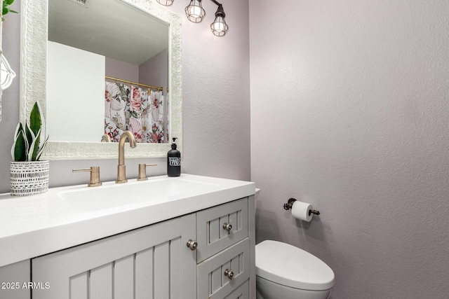 16118 W Morning Glory St, Goodyear, AZ 85338 - bathroom with vanity and a textured wall