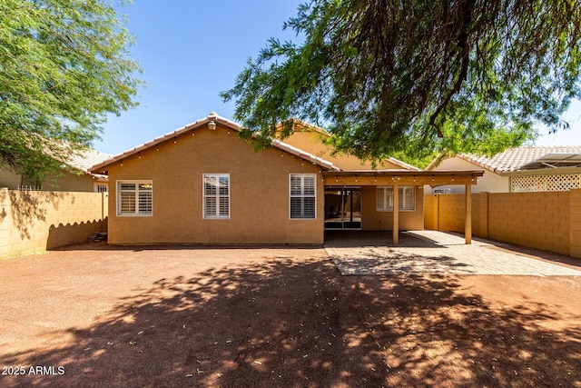 16118 W Morning Glory St, Goodyear, AZ 85338 - back of house featuring a fenced backyard, stucco siding, and a patio