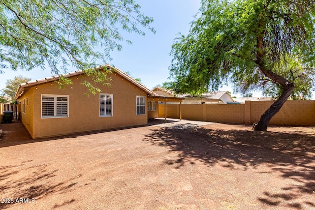 16118 W Morning Glory St, Goodyear, AZ 85338 - back of house featuring stucco siding, a patio, and a carport