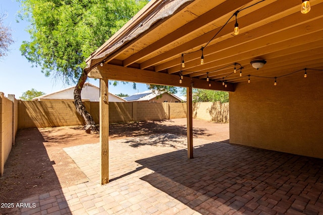 16118 W Morning Glory St, Goodyear, AZ 85338 - fenced backyard featuring a patio area